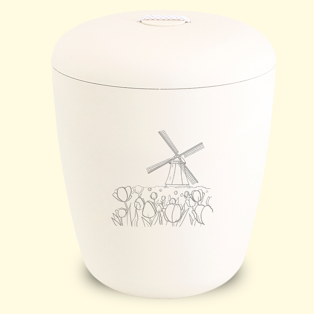 Keltainen biohajoava uurna tuulimylly kuvalla sivustolta www.benutree.fi