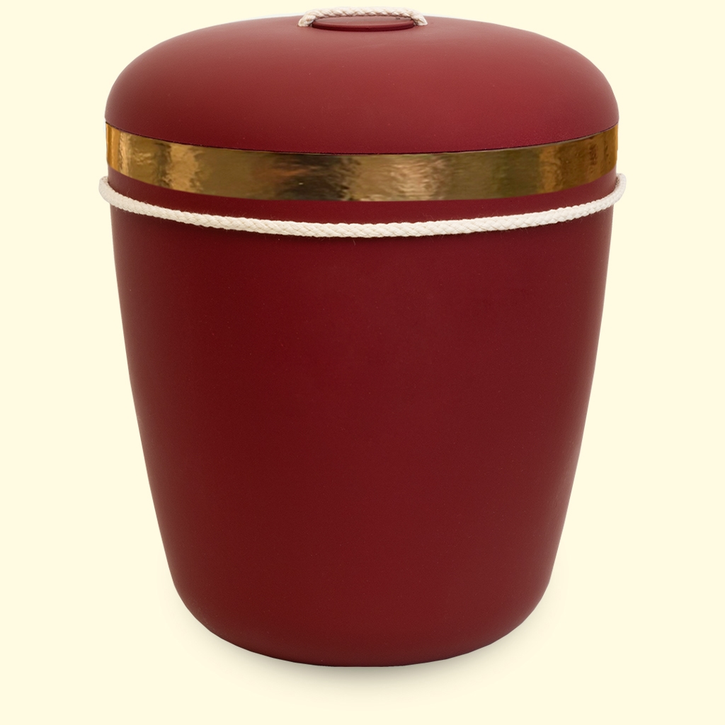 Punainen uurna kultaisella koristeella sivustolta www.benutree.fi